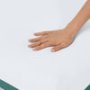 Hand pressing down on the firm Helix Twilight Mattress