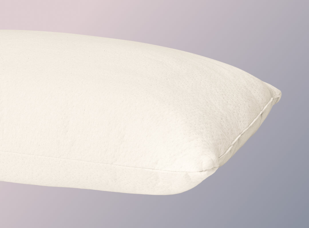 A closeup image of the Organic Pillow on a blue background