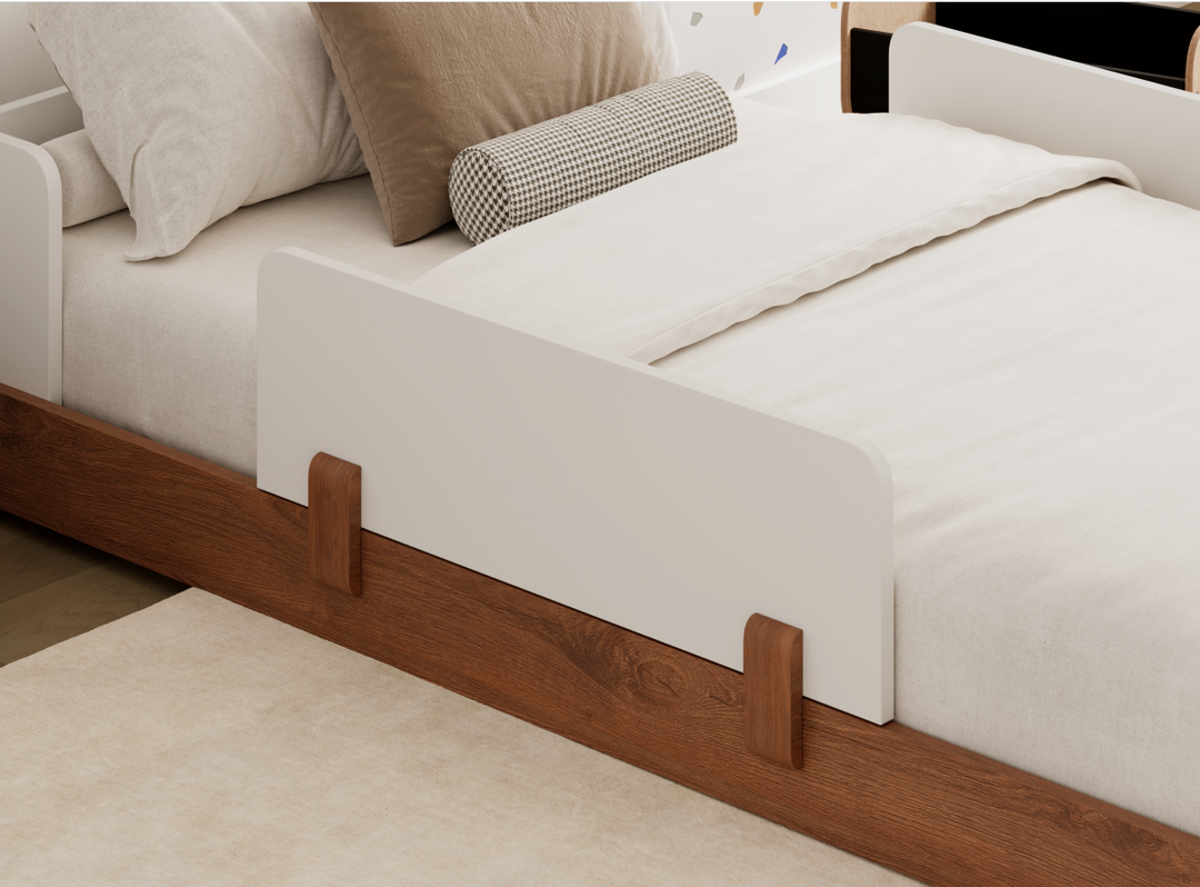 A closeup image of the Bryant Toddler Floor Bed showing its guardrails, which are sold separately 