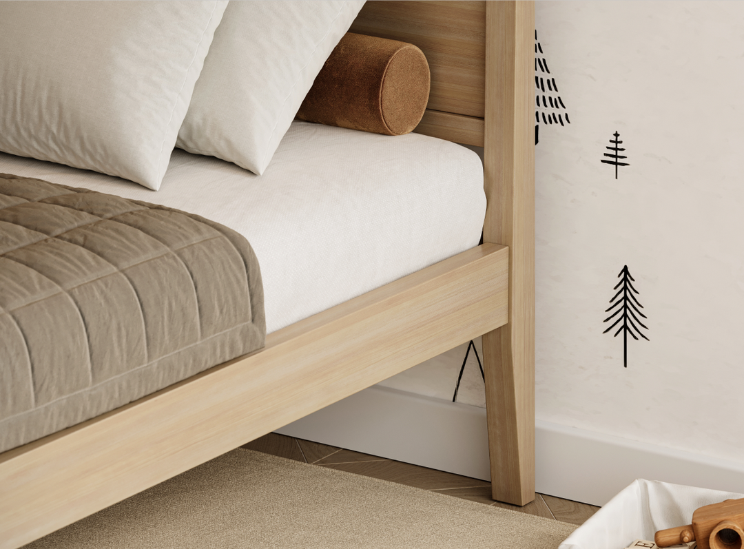 A closeup image of the Cooper Bed Frame showing it's sturdy legs and headboard