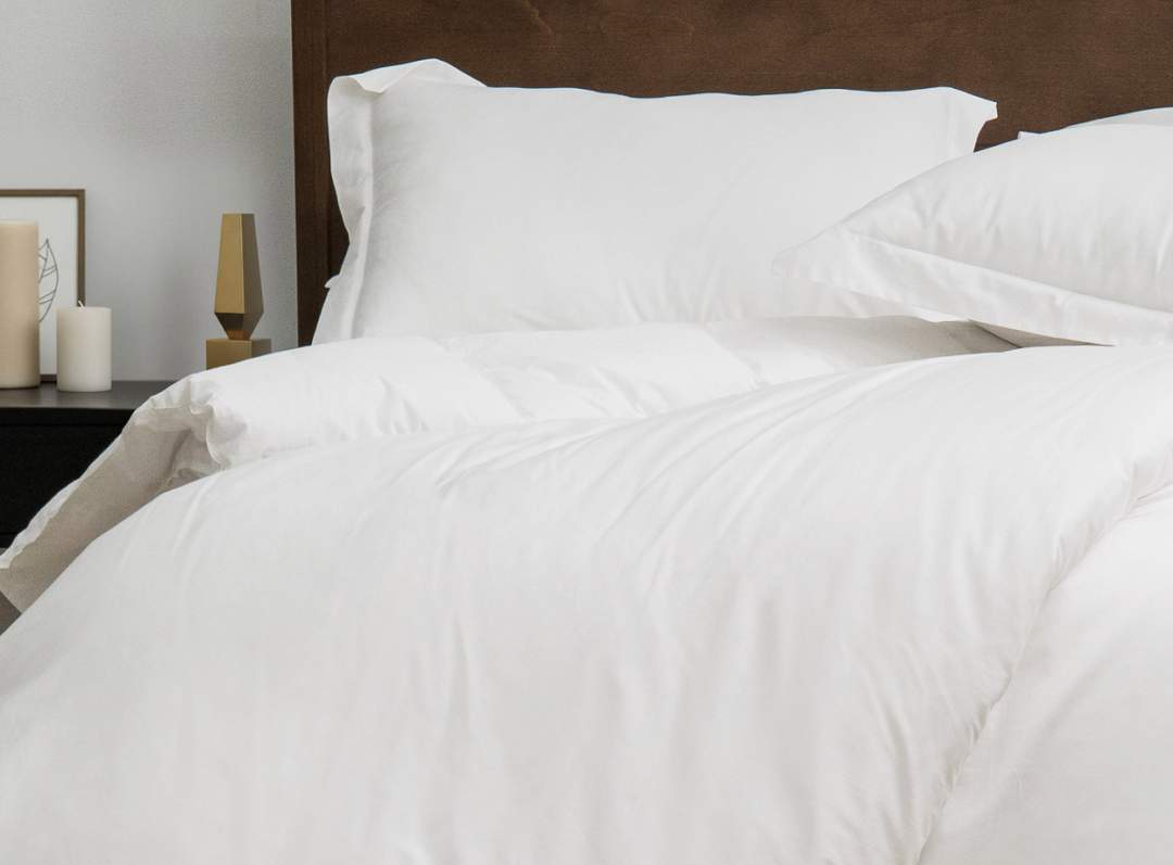 A closeup of the Helix Duvet Cover Set on a bed in a bedroom scene