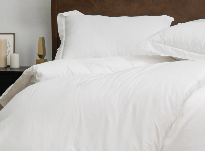 A closeup of the Helix Duvet Cover Set on a bed in a bedroom scene