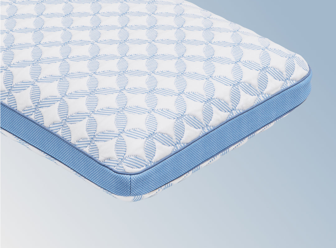 An image of the GlacioTex Cooling Pillow on a light blue gradient background