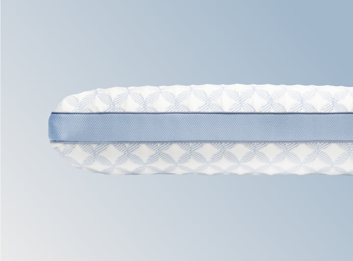 An image of the GlacioTex Cooling Pillow on a light blue gradient background