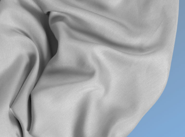 A closeup of the Cotton Blend Sheet Set on a blue background