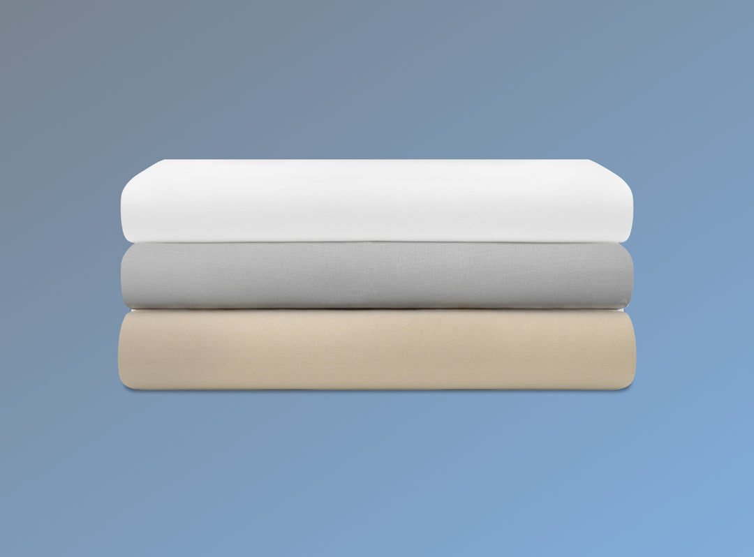 An image of the Cotton Blend Sheet Sets folded and stacked on a blue background