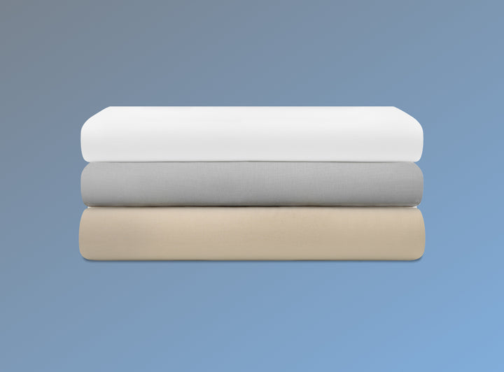 An image of the Cotton Blend Sheet Sets folded and stacked on a blue background