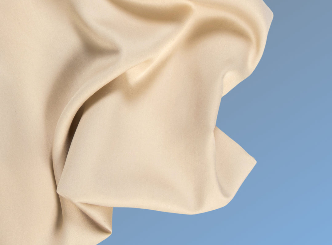 A closeup of the Cotton Blend Sheet Set on a blue background