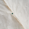 A closeup of the Birch Duvet Insert showing the Birch logo tag