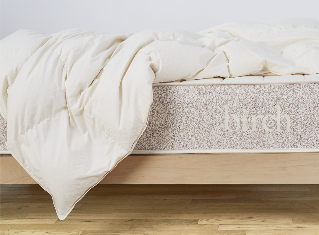 The Birch Duvet Insert laid across a Birch mattress in a bedroom scene
