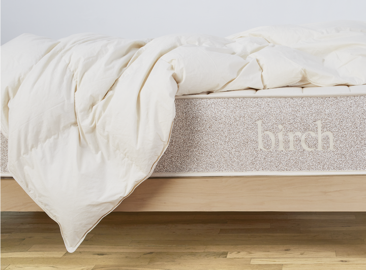 The Birch Duvet Insert laid across a Birch mattress in a bedroom scene