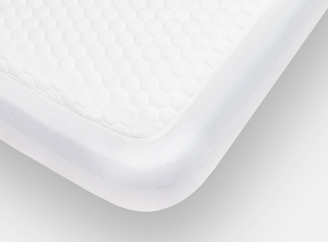 A closeup of the GlacioTex Mattress Protector showing it's snug fit on your mattress