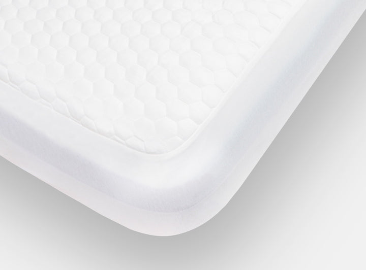 A closeup of the GlacioTex Mattress Protector showing it's snug fit on your mattress