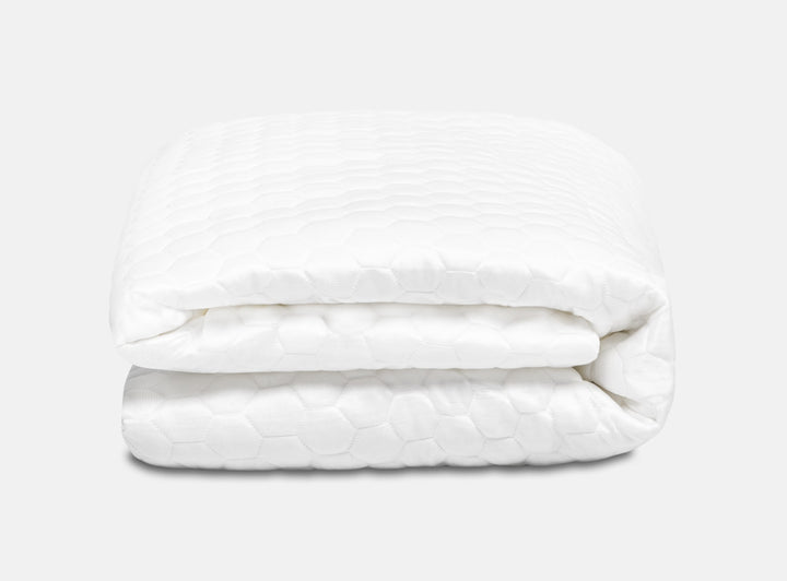 An image of the GlacioTex Mattress Protector folded up on a white background