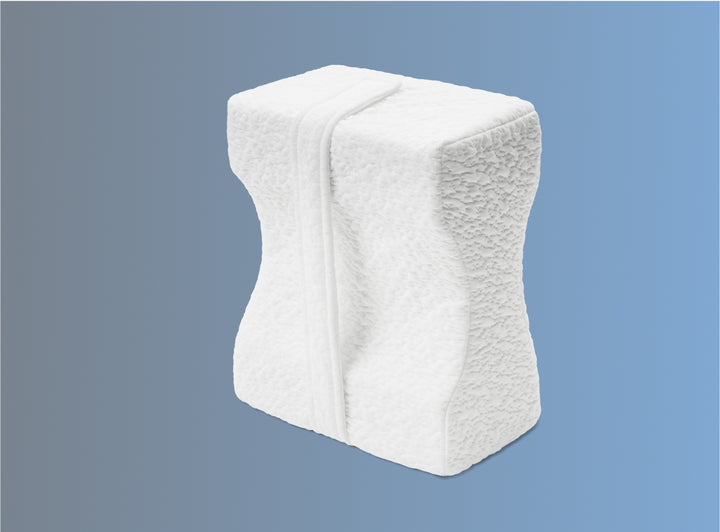 The Helix Knee Pillow on a blue background