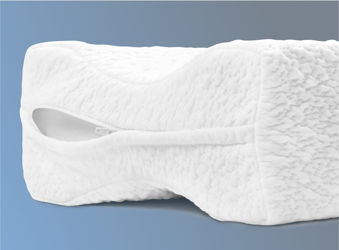 A closeup image of the Helix Knee Pillow on a blue background