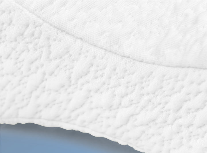 A closeup image of the Helix Knee Pillow on a blue background