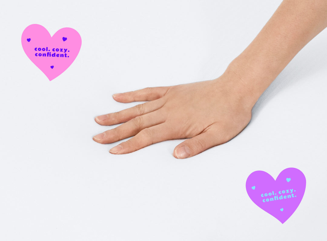 A closeup of the Kids Waterproof Mattress Encasement with a hand feeling the surface