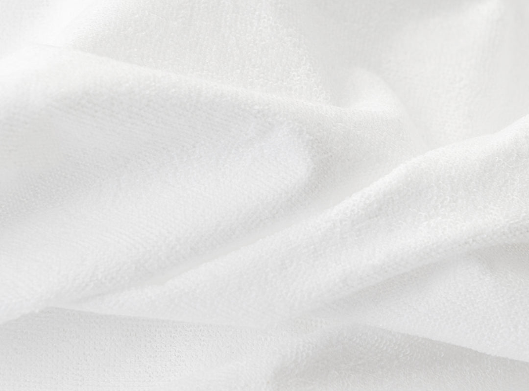 A closeup of the Waterproof Mattress Protector showing it's soft, waterproof fibers