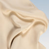 A closeup of the Tencel Sheet Set on a blue background