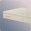 Mattress with 'birth' branding on a light gray background