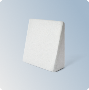 The Helix Wedge Pillow on a blue gradient background