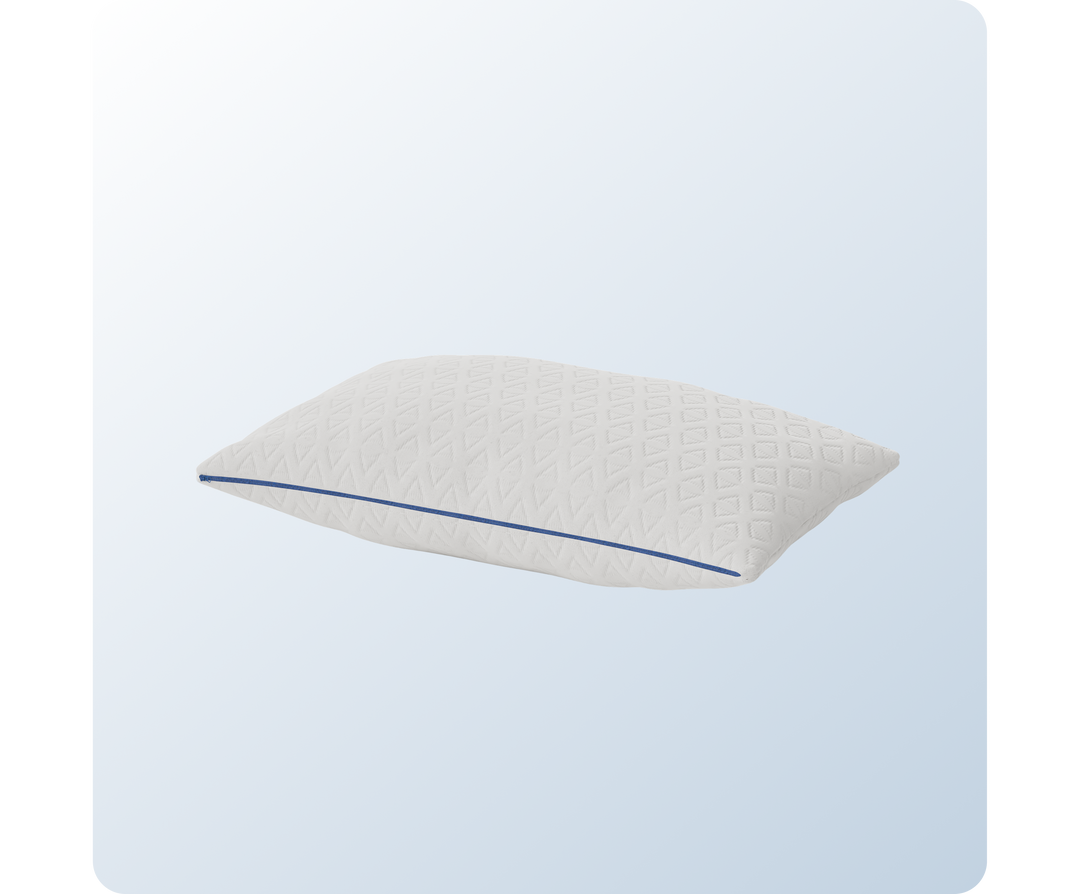 A product image of the ComfortAdjust Cooling Pillow showing it zipped with a low loft. 