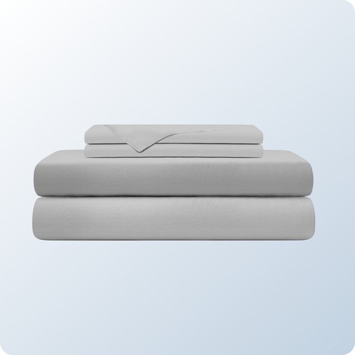 An image of the Cotton Blend Sheet Set on a blue background gradient